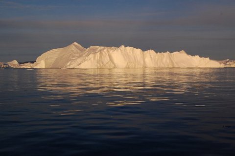 Ice berg in midnight sun in the Icefjord, Greenland